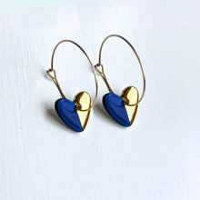 Load image into Gallery viewer, Hoop earrings with dark blue heart charms - gold
