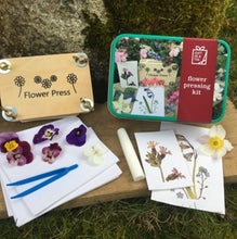 Load image into Gallery viewer, Flower pressing in a tin
